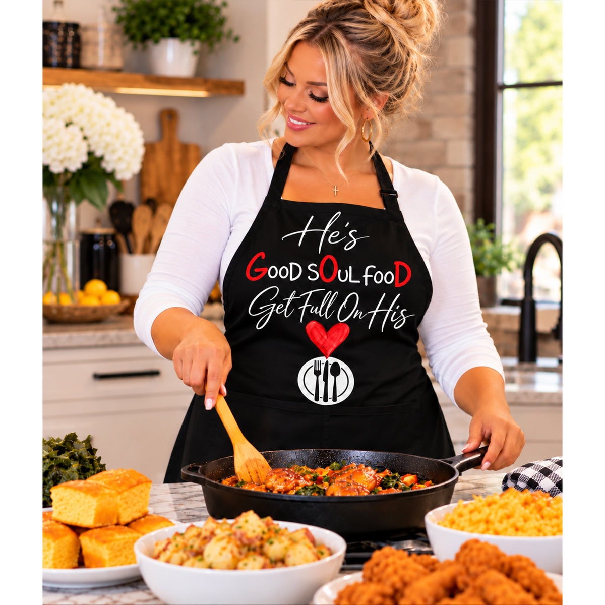 Woman cooking while wearing the Look Up Pray Up HE'S GOOD SOUL FOOD apron